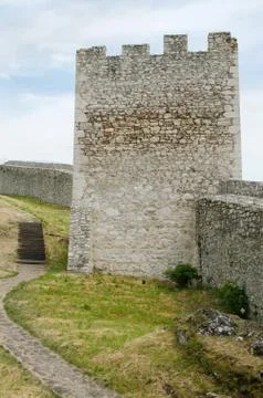 Old repaied gothic castle tower and bit of coutyard. Stock Photos