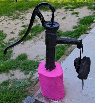 Old restored hand water pump Stock Photos