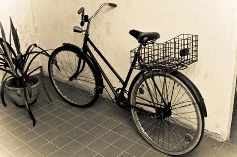 Old retro bicycle leaned the wall Stock Photos