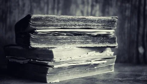 An old retro book on the table. An encyclopedia of the past on an old woode.. Stock Photos