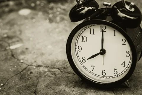 Old retro clock with space for text sepia color at 8 o'clock. Stock Photos