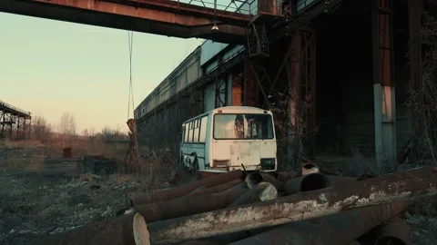 Old retro rusty broken abandoned bus in dark industrial post apocalyptic Stock Footage 146490825