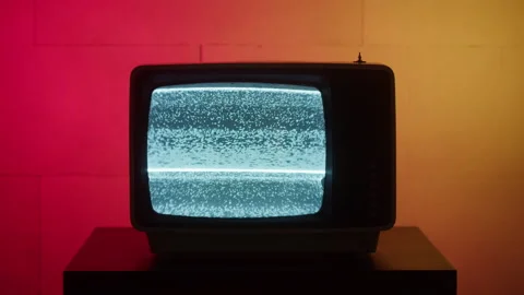 Old retro square television on red and yellow neon background, screen with Video stock 161976062