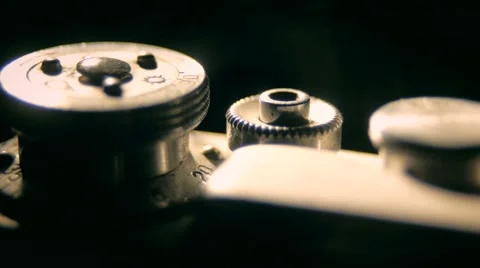 Old retro style camera buttons in the white light in the dark studio indoors Stock Footage 64856431