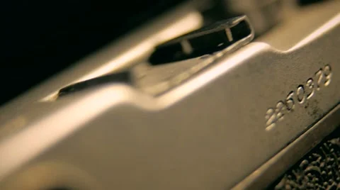 Old retro style camera buttons sliding in  the dark in the white lights  studio Stock Footage 64856572