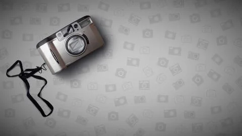 A old retro style closed shutter slr camera placed on a custom designed surfa Stock Photos