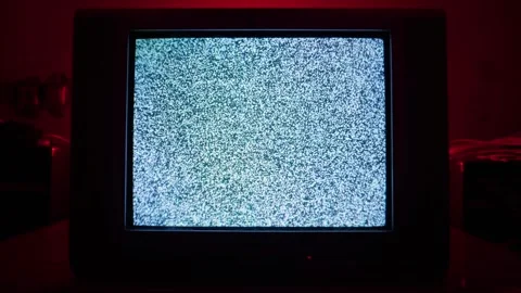 Old Retro Television Screen Displaying Static White Noise in Eerie Red Glow Stock Footage 335633946