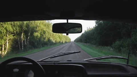 An old retro unic car dashboard driving on a narrow highway Stock Footage 135546333
