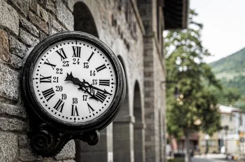 Old retro wall clock at a train station Stock Photos