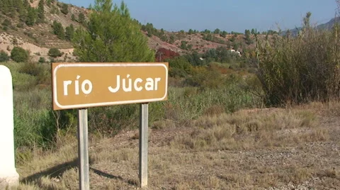 Old road sign announcing important river Stock Footage 49964860