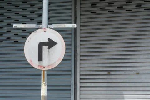 Old road sign for a sharp right hand turn., sign turn right with copy space f Stock Photos