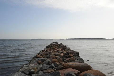 Old rock jetty Stock Photos