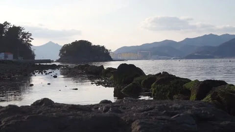 Old Rock Tidal Fish Trap at Beach, Sunset over Mountains, HD Stock Footage 194898132