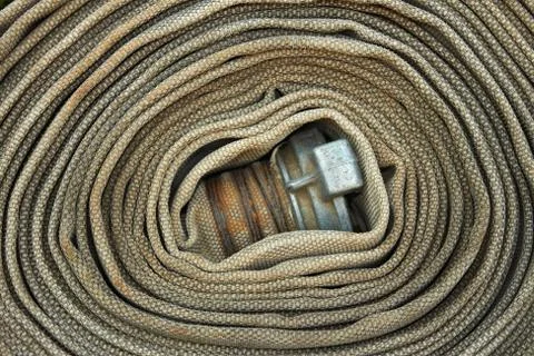 Old rolled fire hose Stock Photos