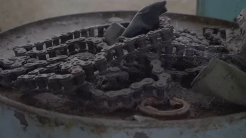 Old Roller Chain on a Metal Drum Stock Footage 219466634