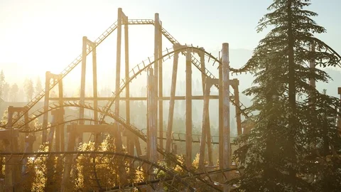 Old roller coaster at sunset in forest Video stock 100357237