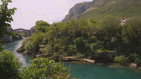 Old Roman Arch Bridge Crossing Neretva River in Mostar, Bosnia and Herzegovina 動画素材 345205941