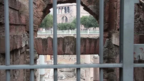 Old rome ancient metal gate with people walking in background Stock Footage 252147382
