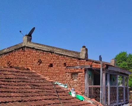 Old roofing and red bricks warehouse with sky background, Attic, Dormers and Eav Stock Photos