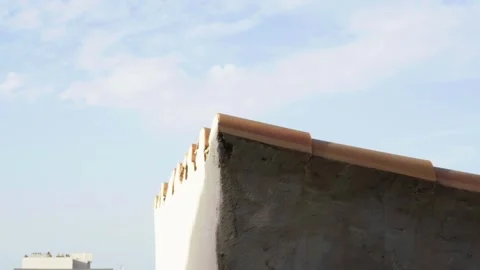 Old rooftop in blue clear sky, clouds, Balearic Islands, shadow line, Mallorca Stock Footage 282315871