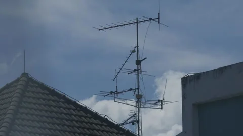 Old rooftop television antenna with multiple elements Stock Footage 336593425