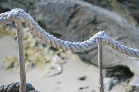 Old rope on the beach Stock Photos