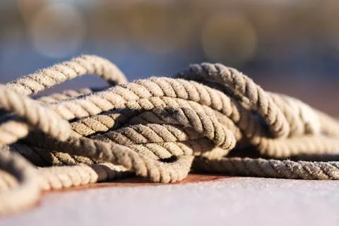 Old rope lying on the ground Stock Photos