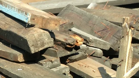 Old rotten boards. Rusty nails stick out Stock Footage 115328657