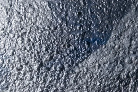Old rough surface of a concrete wall with an uneven coating Stock Photos