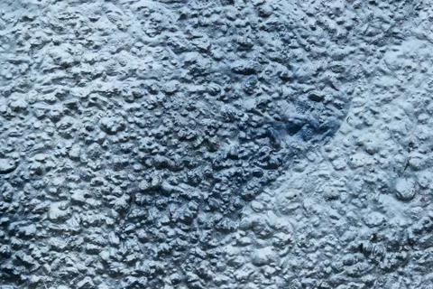 Old rough surface of a concrete wall with an uneven coating Stock Photos