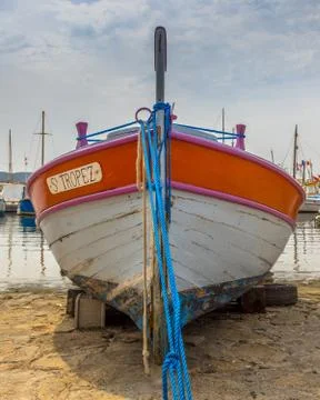 Old rowing boat on beach Stock Photos