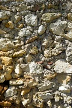 Old rubble stone wall construction full frame texture background Stock Photos