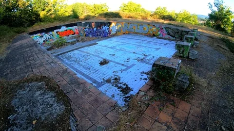 AN OLD RUINED SWIMMING POOL Stock Footage 94449569