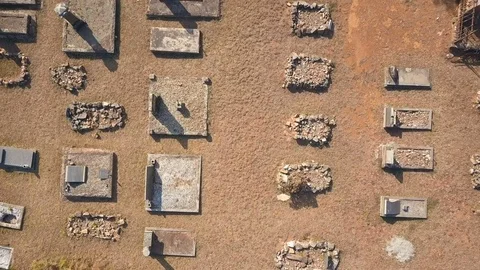 Old rural graveyard viewed from above with large tree in the middle Stock Footage 78584557