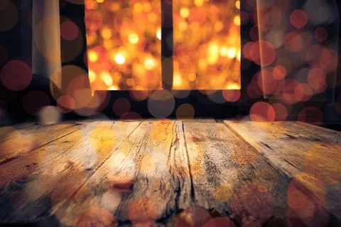 Old rural interior: window table overlooking blurry lights Stock Photos