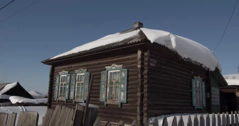 Old Russian log house covered with snow. Winter in the village. Stock Footage 138856899