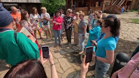 Old Russian rite for entry, reading chants and sayings among tourists 06/20/2023 Stock Footage 259546044