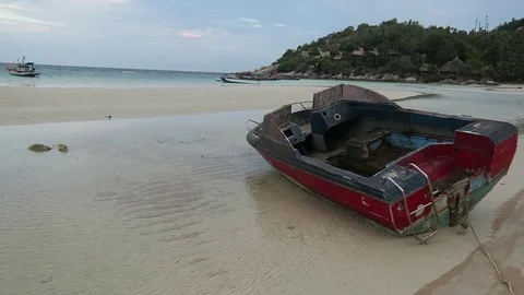 Old rusted boat sits beached Stock Footage 80899985