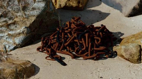 Old rusted chain in the sand Stock Illustration