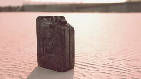 Old rusted fuel can on the beach Stock Footage 237595754