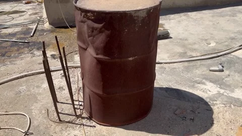Old Rusted Metal Drum on a Rooftop Stock Footage 345207923