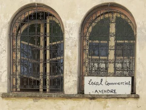 Old rusted ornate window security grills Stock Photos