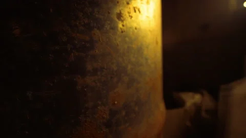 Old rusted storage barrel in the dark abandoned garage Vídeo Stock 131116498