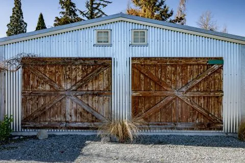 Old Rustic Barn Doors on a TIn Shed Stock Photos