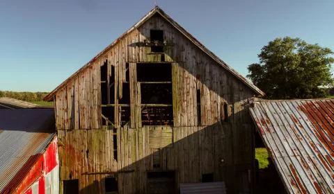 Old Rustic Barn Glowing in the Summer Sunset Stock Photos
