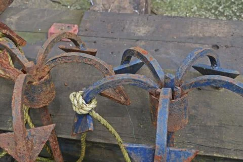Old rustic boat anchor Stock Photos