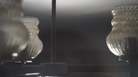An old rustic chandelier swings from side to side Stock Footage 168514679
