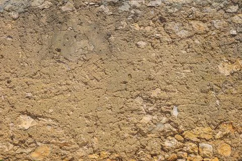 Old, rustic corroded stone and plaster wall Stock Photos