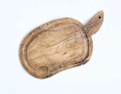 Old rustic cutting board made of olive wood on a white backgroun Stock Photos