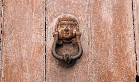 Old Rustic Door Knocker on an old Wooden Door Stock Photos